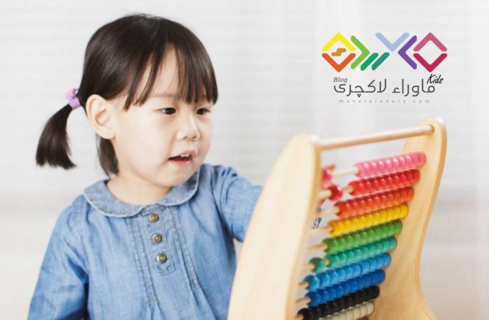 toddler-girl-play-abacus-for-learning-math-at-home-against-white-picture-id1201026108